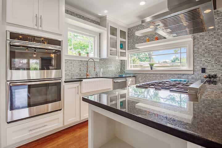 An image of a modern kitchen with sleek appliances, featuring a gas stove, refrigerator, and built-in microwave in Amarillo